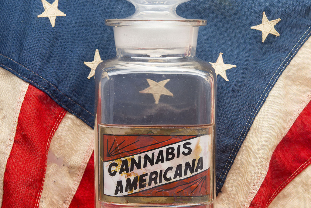 Cannabis Americana Image of Glass Container with American Flag Background